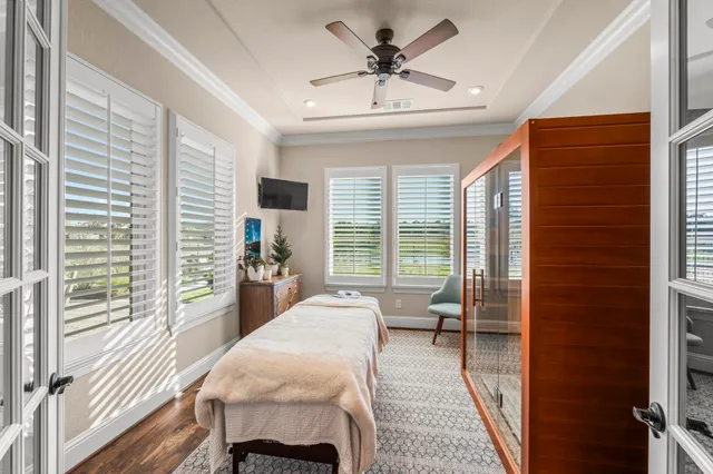 a bed room with a bed and a chair