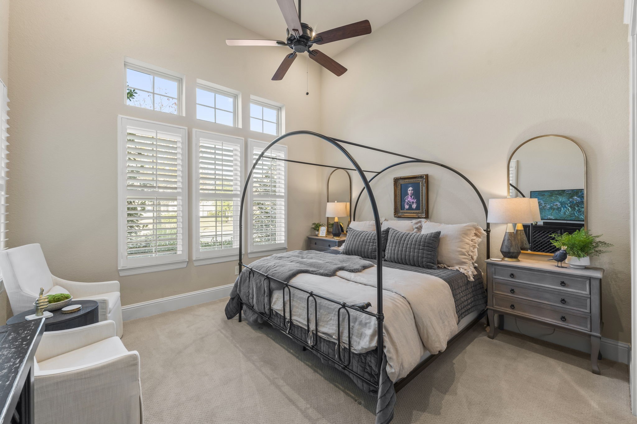 2203 Flameleaf Court Conroe, TX 77384 - Photo 29 of 49 a bedroom with a bed a dresser and windows