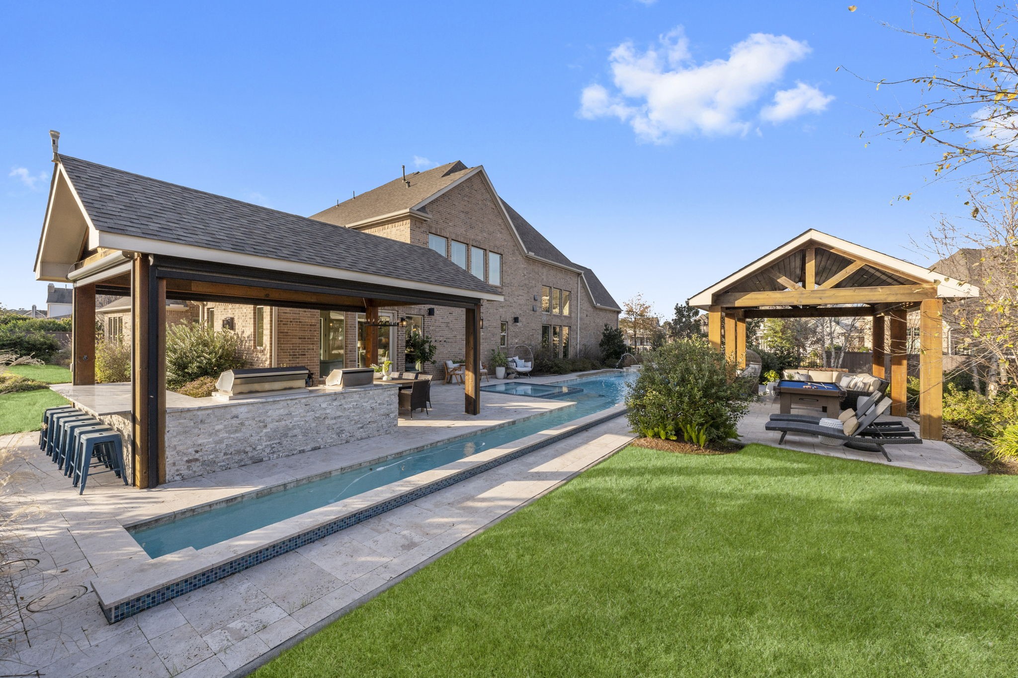 2203 Flameleaf Court Conroe, TX 77384 - Photo 45 of 49 a view of a house with a yard porch and furniture