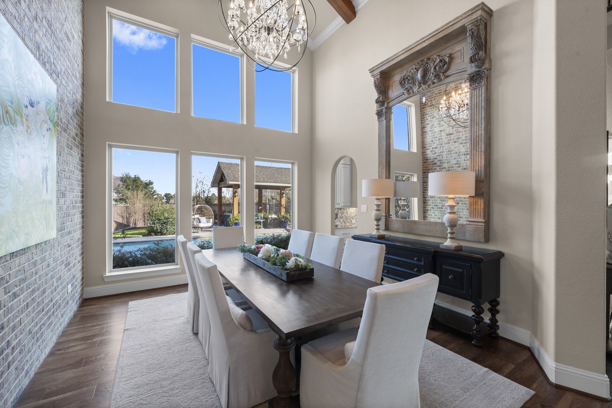 2203 Flameleaf Court Conroe, TX 77384 - Photo 9 of 49 a dining room with furniture and a floor to ceiling window