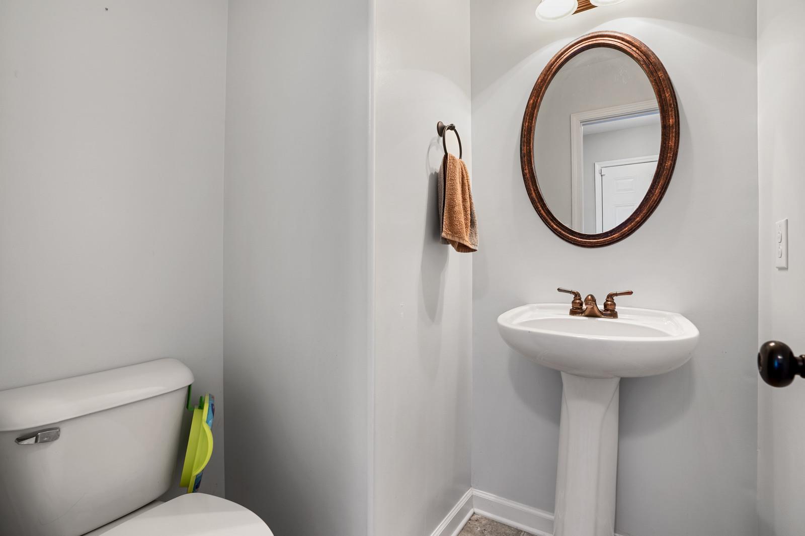 3787 Suiter Road Clarksville, TN 37040 - Photo 10 of 23 a bathroom with a sink mirror and toilet