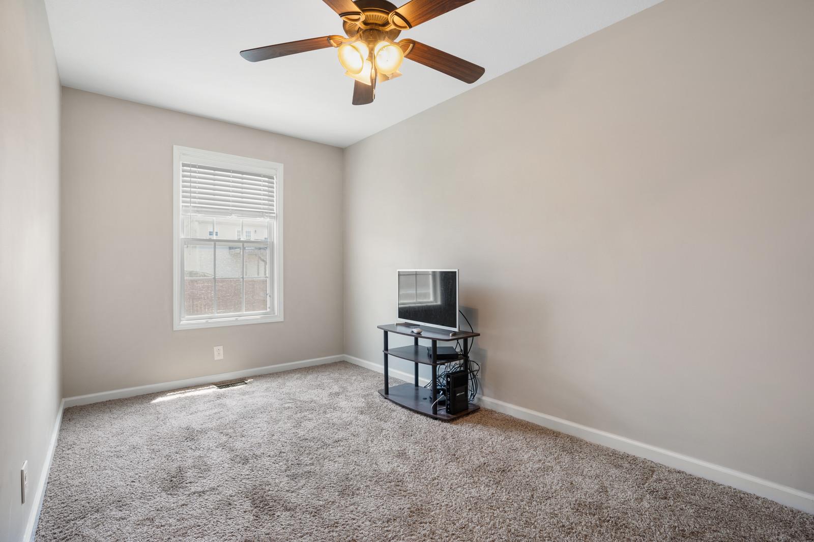 3787 Suiter Road Clarksville, TN 37040 - Photo 11 of 23 a view of workspace with a window and a ceiling fan