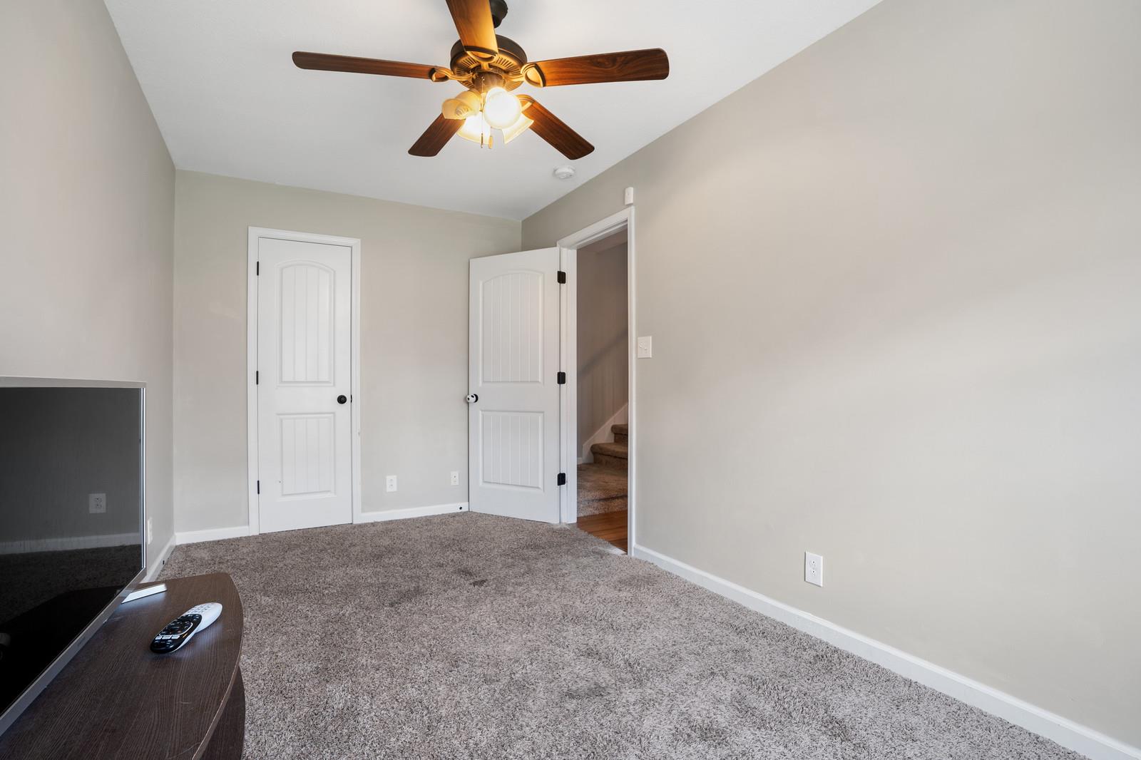 3787 Suiter Road Clarksville, TN 37040 - Photo 12 of 23 an empty room with closet and a chandelier fan