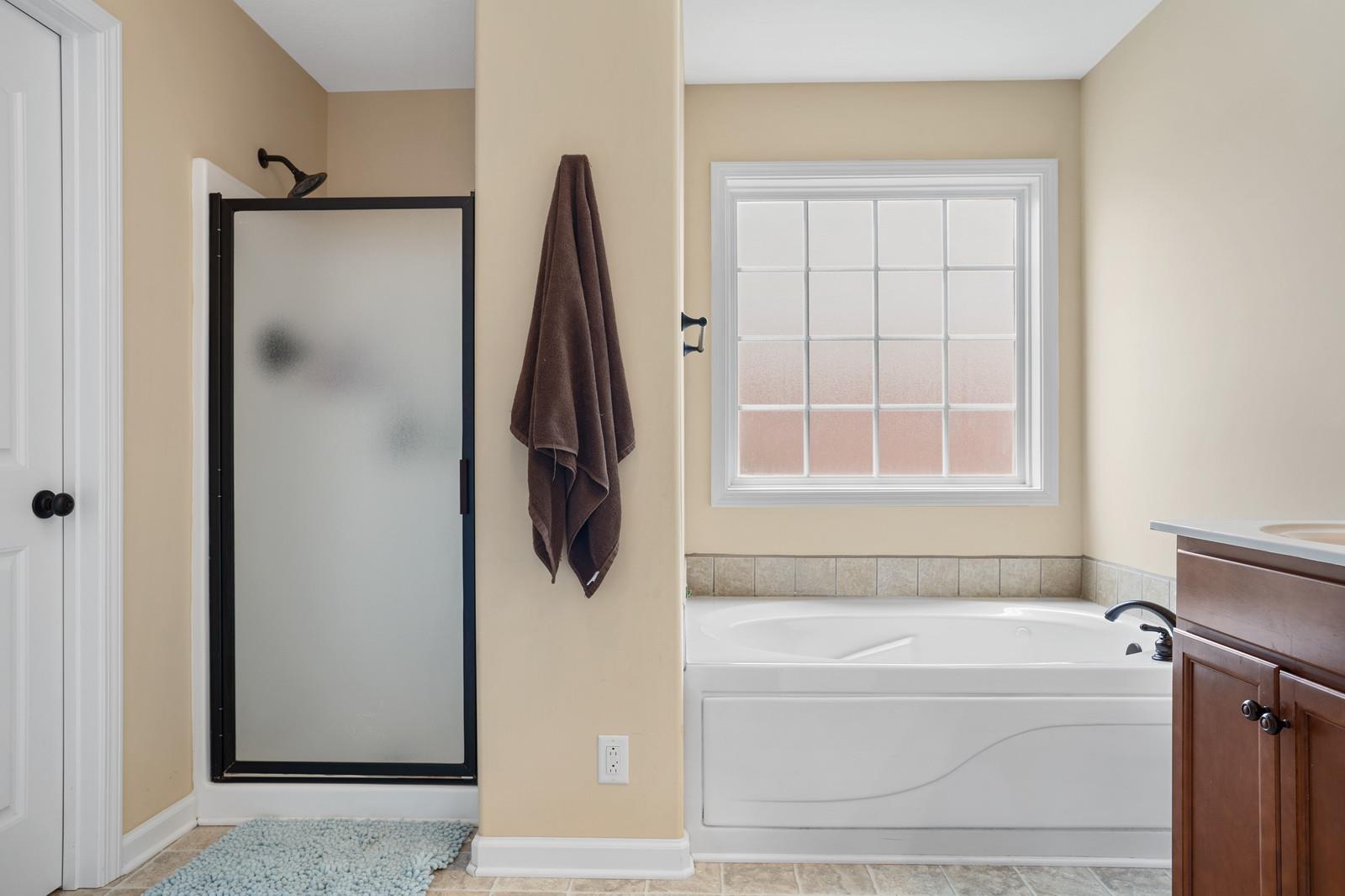 3787 Suiter Road Clarksville, TN 37040 - Photo 16 of 23 a bathroom with a tub and a window