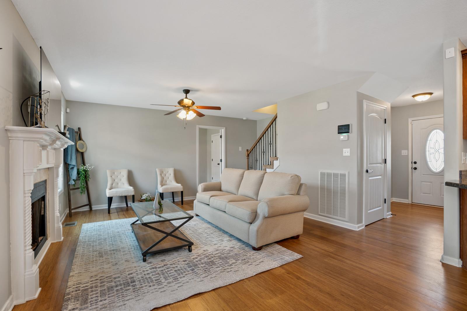 3787 Suiter Road Clarksville, TN 37040 - Photo 23 of 23 a living room with furniture a fireplace and a chandelier