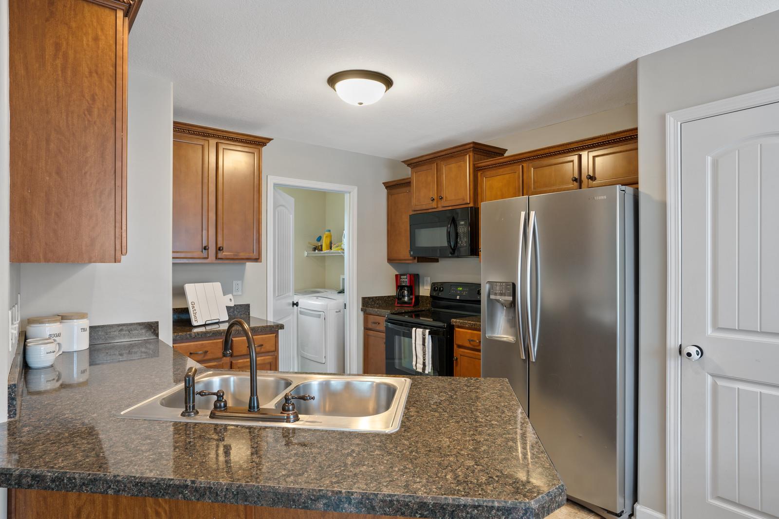 3787 Suiter Road Clarksville, TN 37040 - Photo 7 of 23 a kitchen with kitchen island a counter top space cabinets and stainless steel appliances