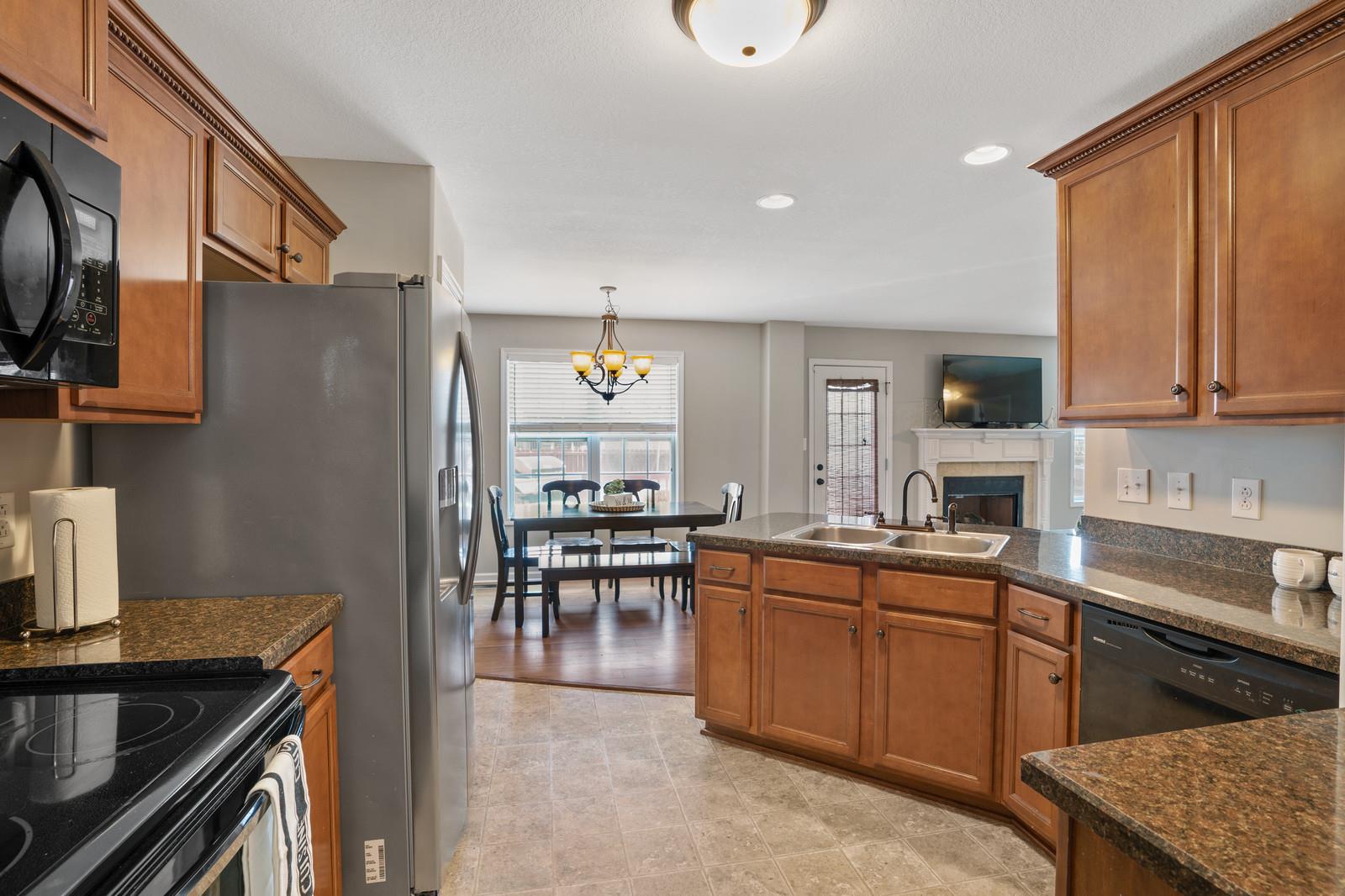 3787 Suiter Road Clarksville, TN 37040 - Photo 8 of 23 a kitchen with cabinets and chairs