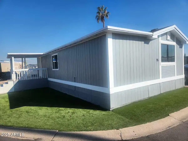 a view of house with backyard and garden