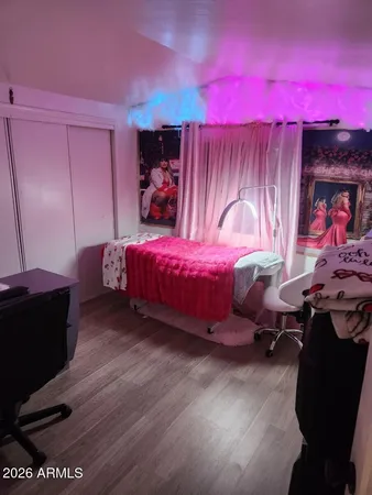 a bedroom with a bed and a mirror