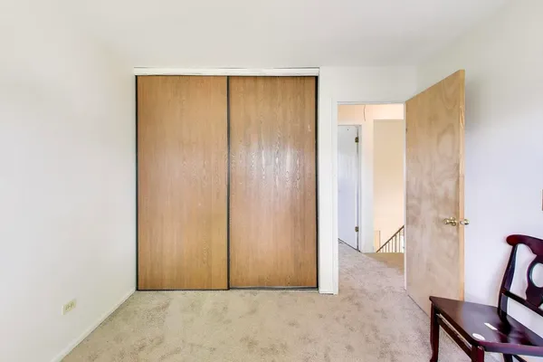 a view of room with furniture and wooden floor