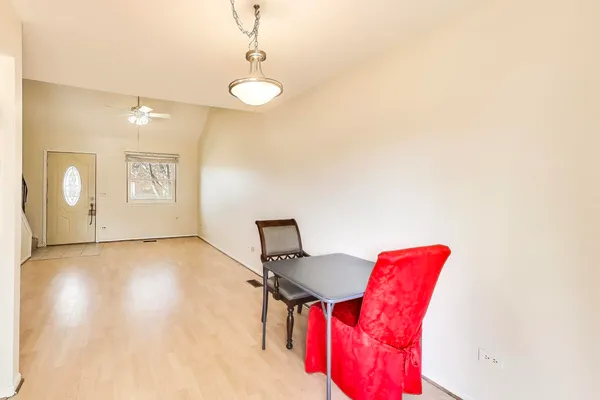 a view of a room with furniture and wooden floor