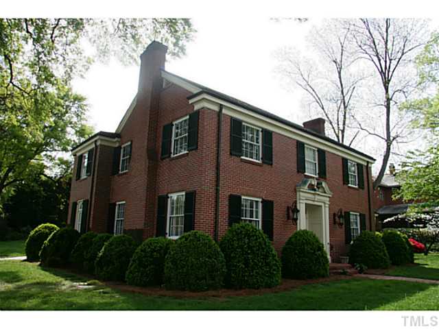 1001 Vance Street Raleigh, NC 27608 - Photo 1 of 15 a front view of a house with a garden