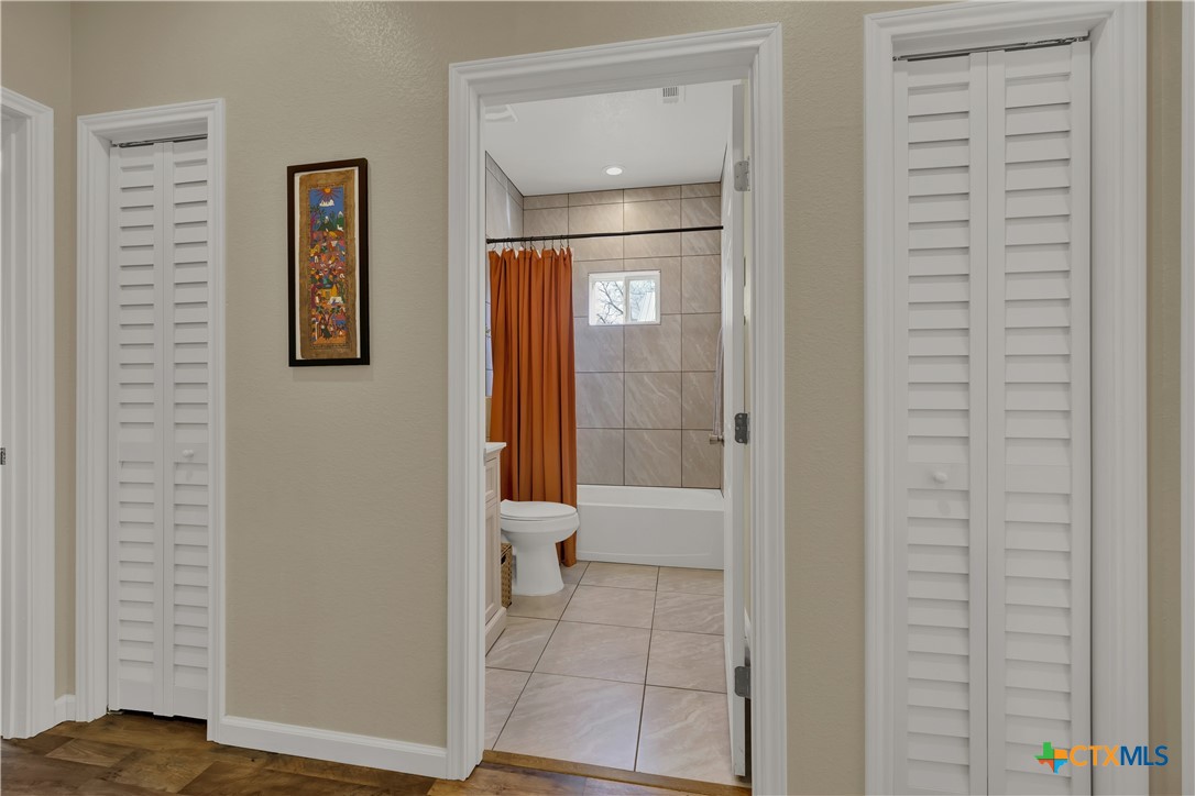 162 Friedens Church Road Seguin, TX 78155 - Photo 17 of 33 a bathroom with a toilet and a shower