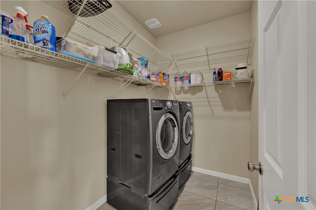 162 Friedens Church Road Seguin, TX 78155 - Photo 21 of 33 a utility room with dryer and washer