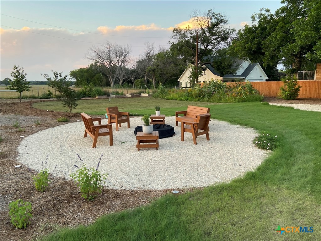 162 Friedens Church Road Seguin, TX 78155 - Photo 23 of 33 an outdoor sitting area with couch and wooden fence