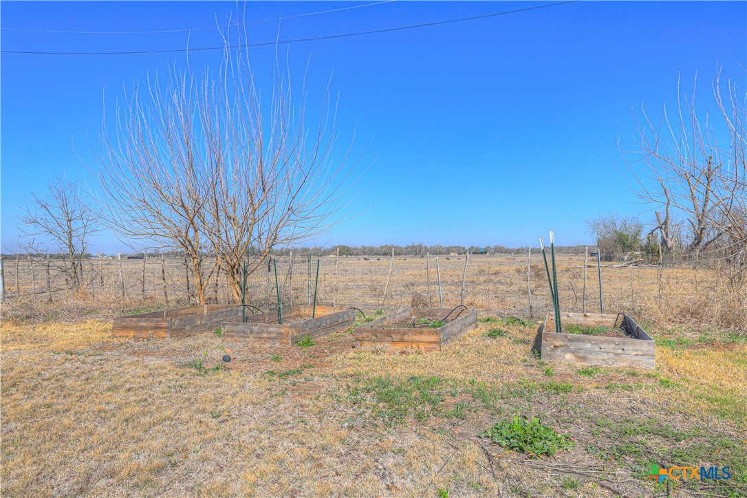 162 Friedens Church Road Seguin, TX 78155 - Photo 32 of 33 a view of a dry yard with wooden fence