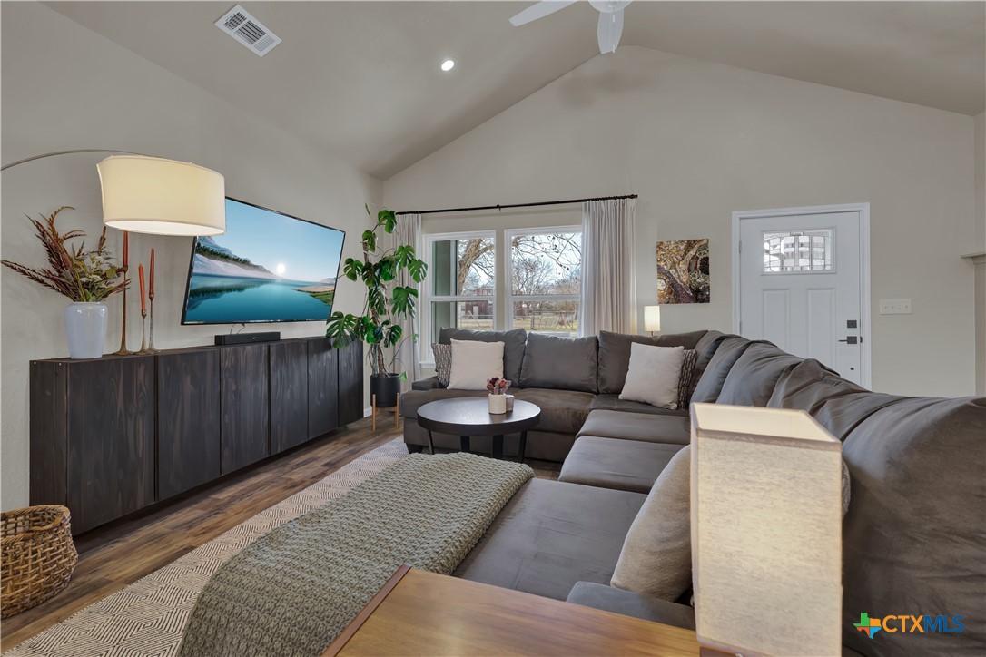162 Friedens Church Road Seguin, TX 78155 - Photo 5 of 33 a living room with furniture and a flat screen tv