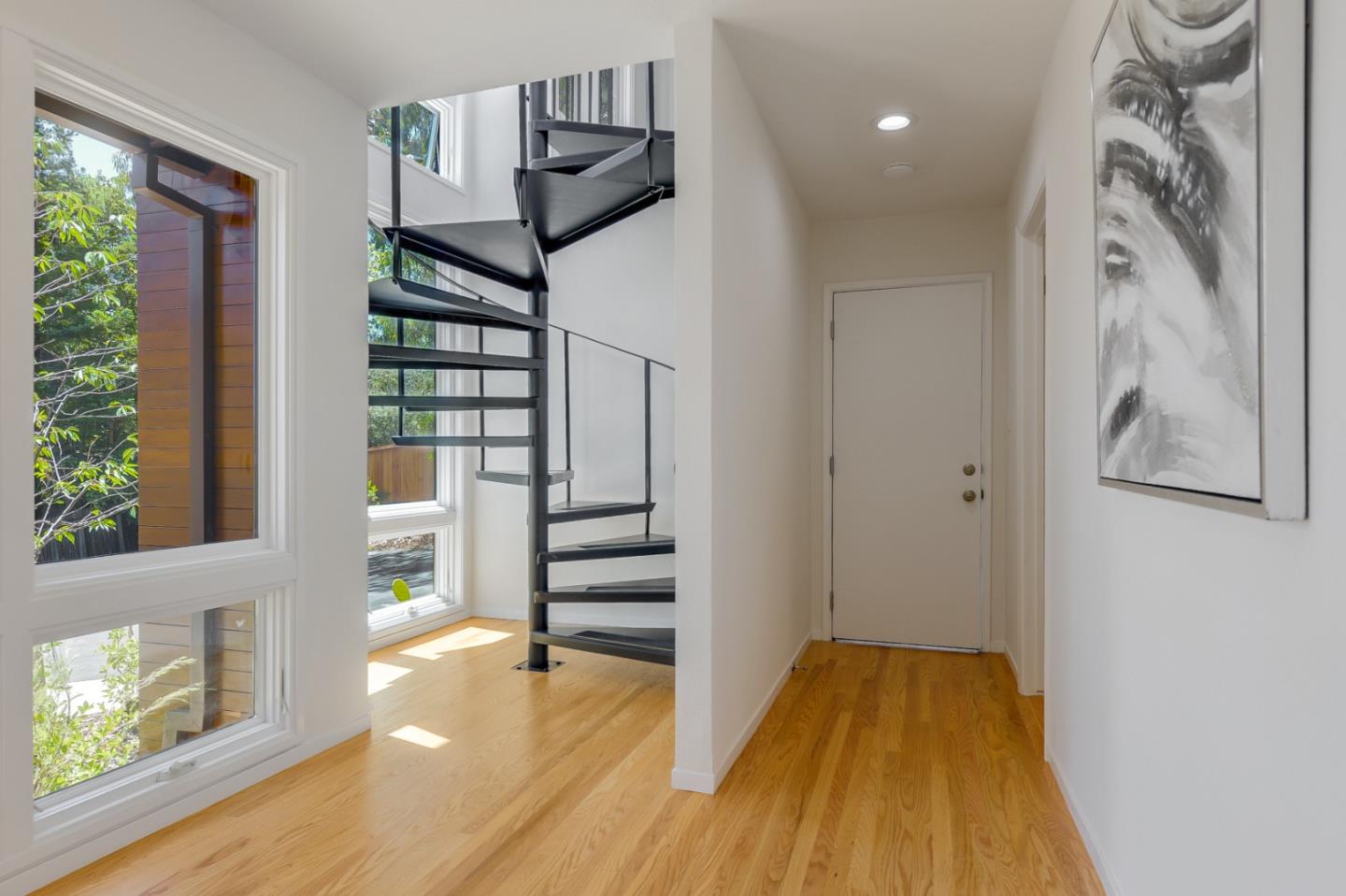 2839 Hillside Drive Burlingame, CA 94010 - Photo 11 of 43 a view of empty room with wooden floor and fan