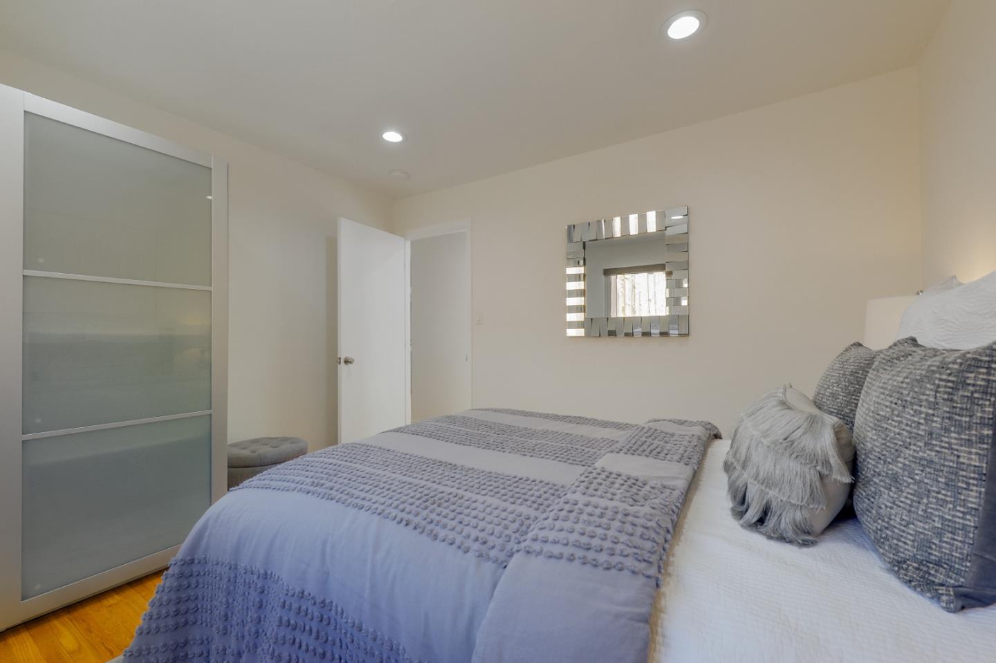 2839 Hillside Drive Burlingame, CA 94010 - Photo 19 of 43 a bedroom with a bed and a window