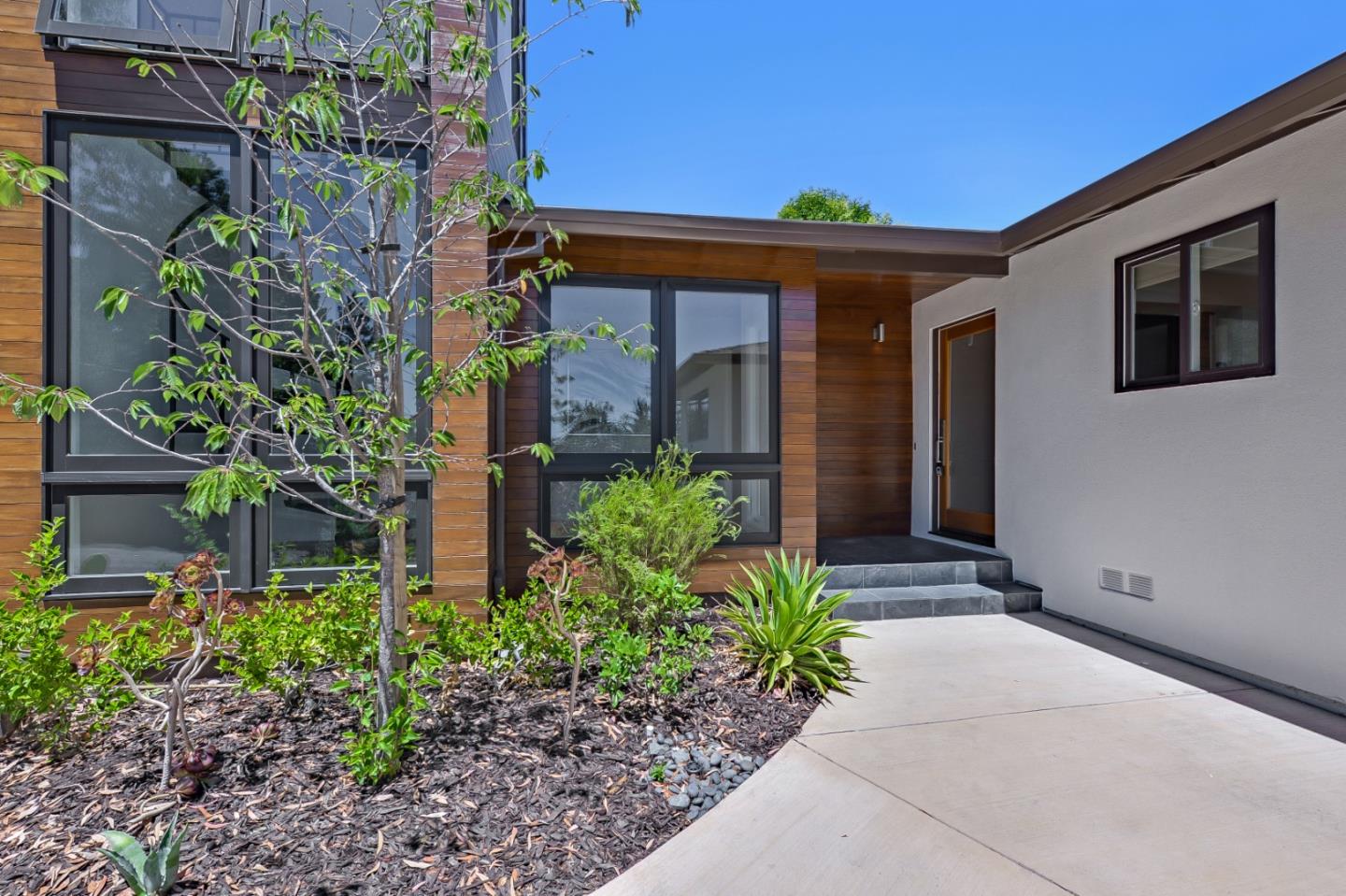 2839 Hillside Drive Burlingame, CA 94010 - Photo 2 of 43 a front view of a house with garden