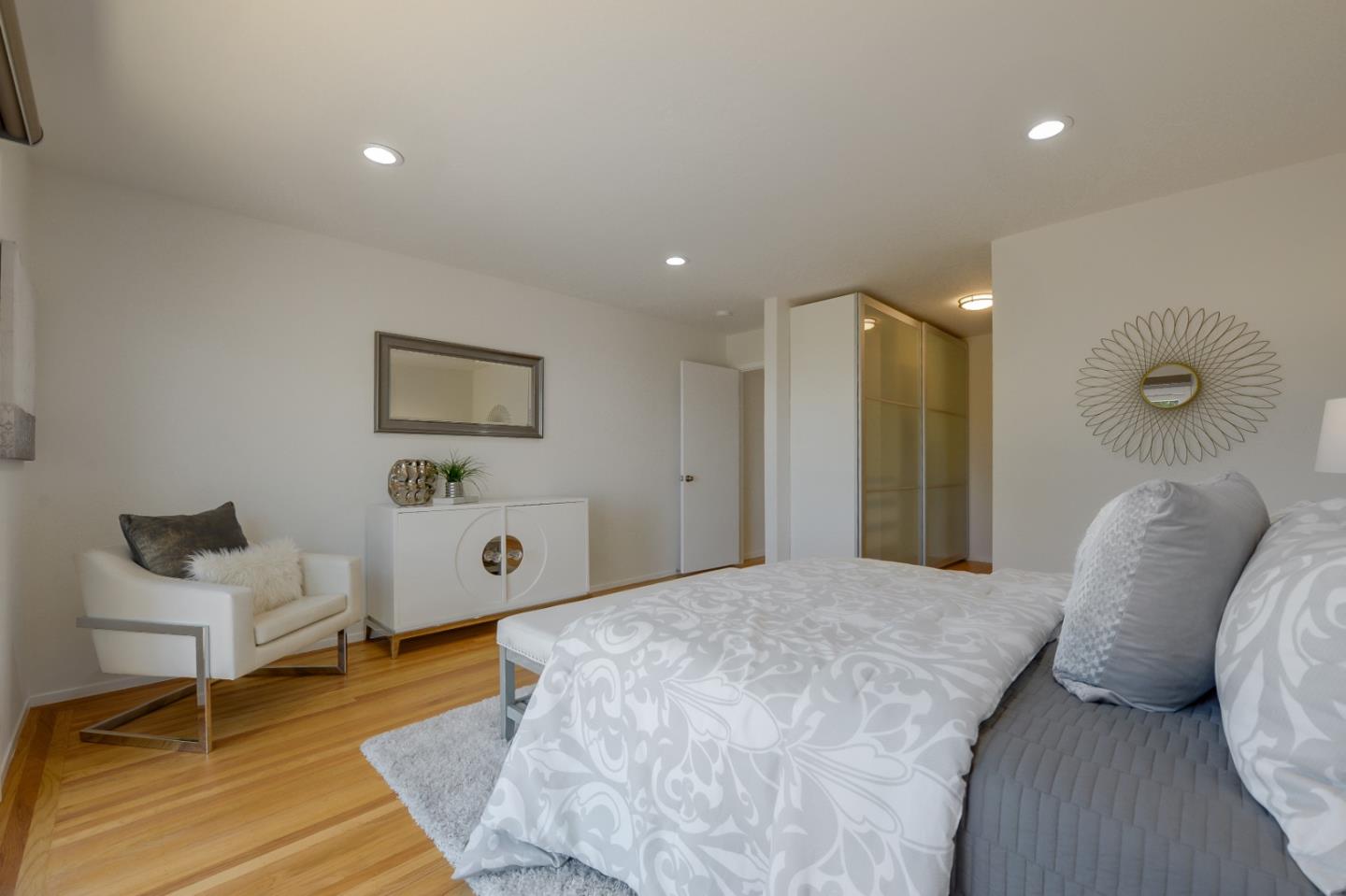 2839 Hillside Drive Burlingame, CA 94010 - Photo 23 of 43 a large bedroom with a bed and furniture