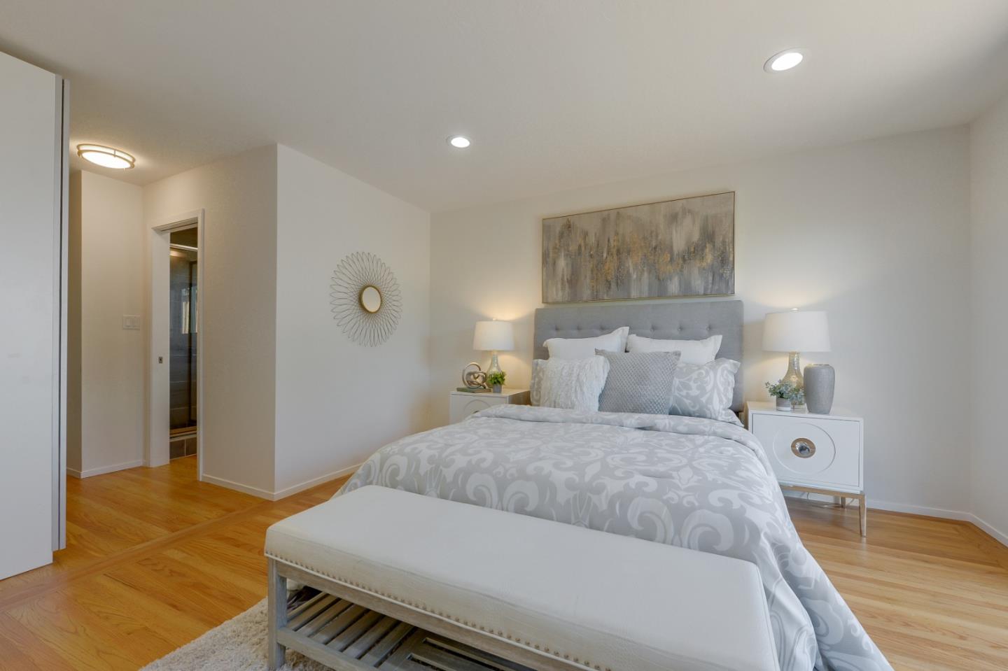 2839 Hillside Drive Burlingame, CA 94010 - Photo 24 of 43 a bedroom with a bed and a couch