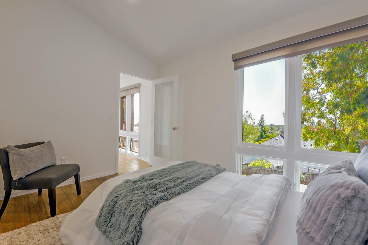 2839 Hillside Drive Burlingame, CA 94010 - Photo 26 of 43 a bedroom with a bed window and table