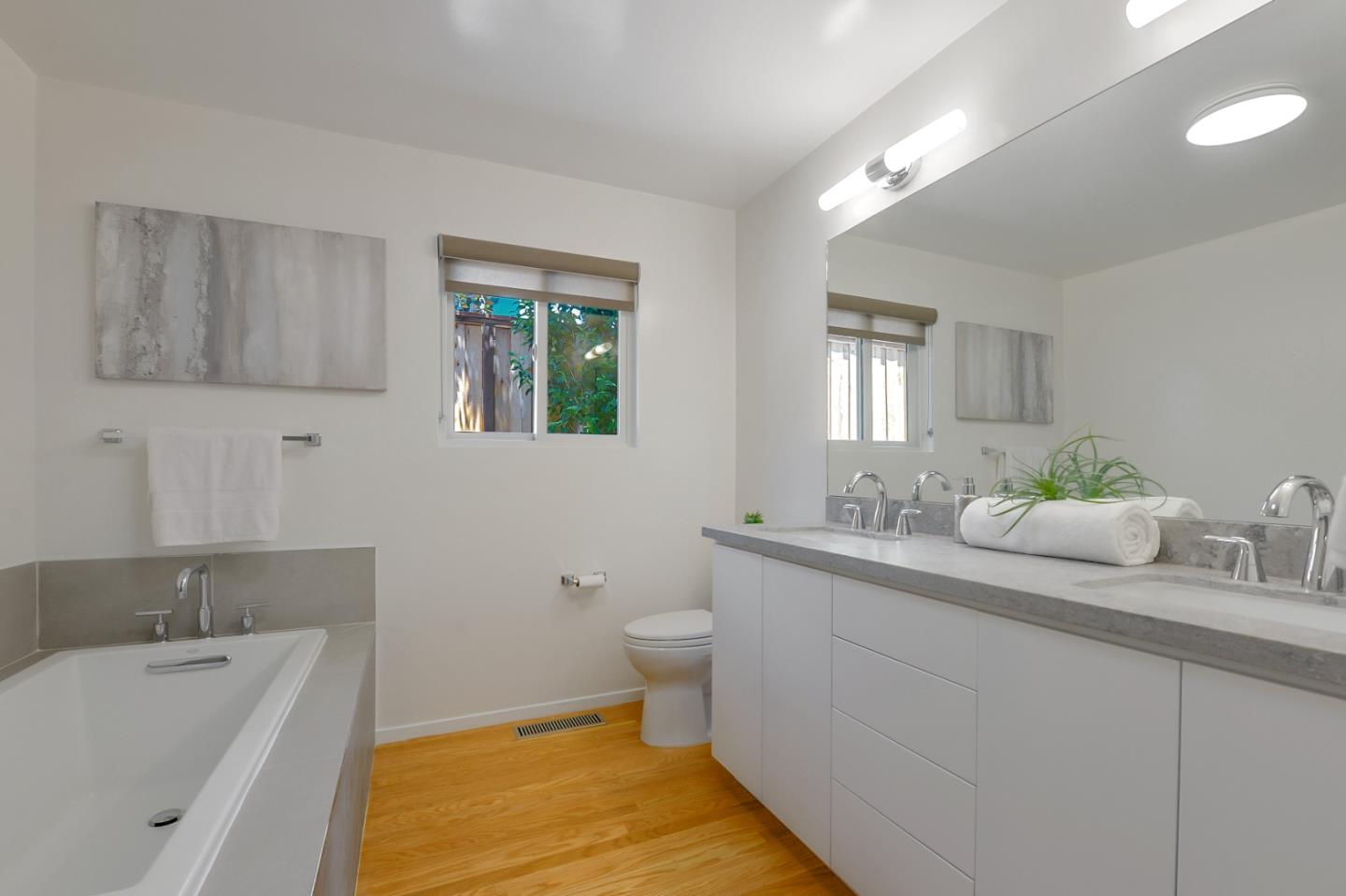 2839 Hillside Drive Burlingame, CA 94010 - Photo 27 of 43 a bathroom with a granite countertop sink and a mirror