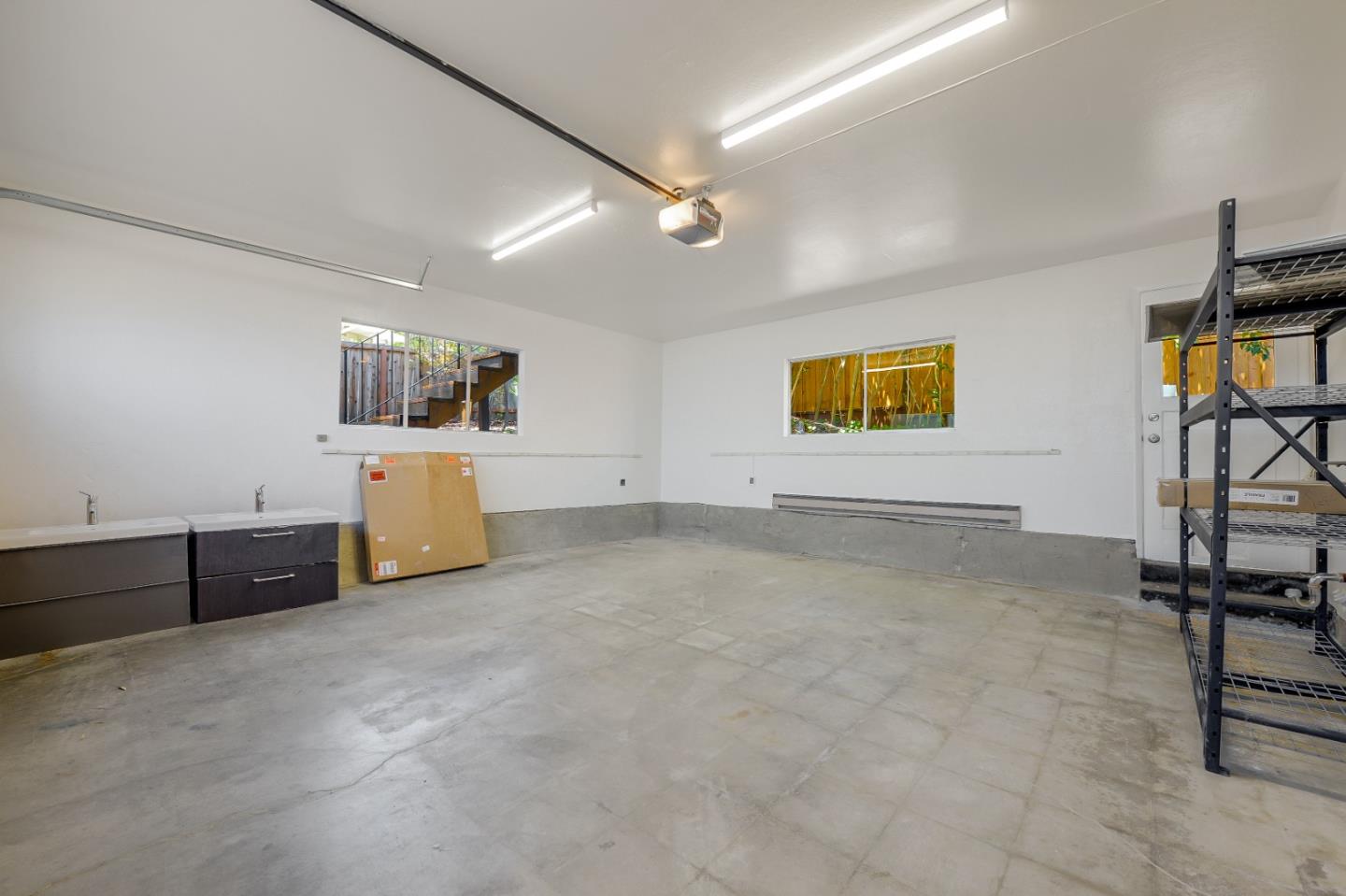 2839 Hillside Drive Burlingame, CA 94010 - Photo 32 of 43 a view of room with flat screen tv and windows
