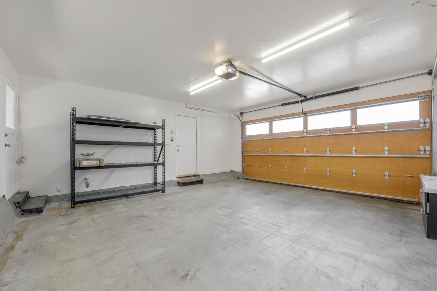 2839 Hillside Drive Burlingame, CA 94010 - Photo 33 of 43 an empty room with a fireplace and cabinet
