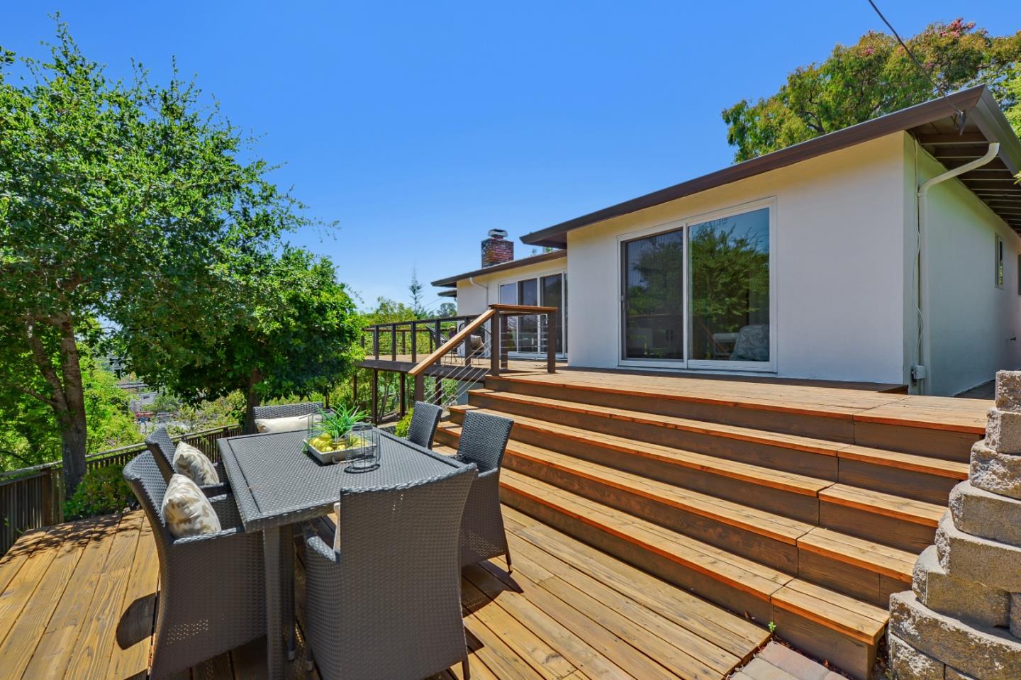 2839 Hillside Drive Burlingame, CA 94010 - Photo 35 of 43 a view of a patio with a table and chairs