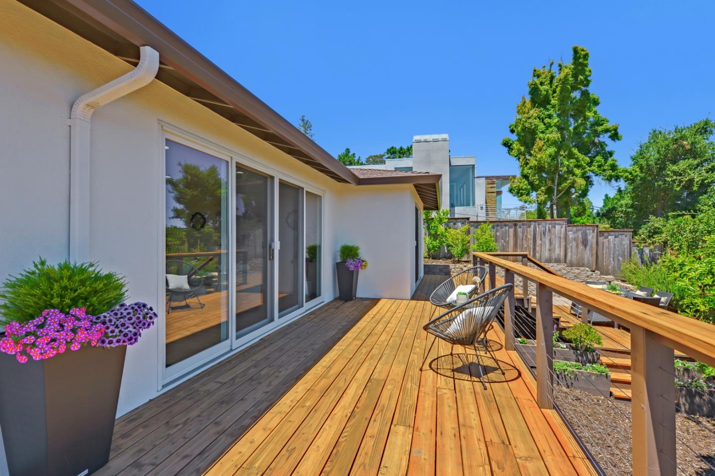 2839 Hillside Drive Burlingame, CA 94010 - Photo 40 of 43 a view of two chairs in patio with wooden fence