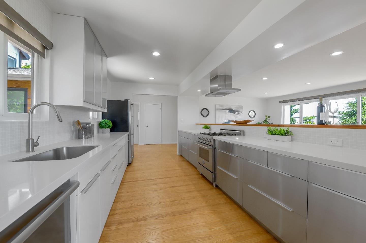 2839 Hillside Drive Burlingame, CA 94010 - Photo 7 of 43 a large kitchen with stainless steel appliances lots of counter space and a sink