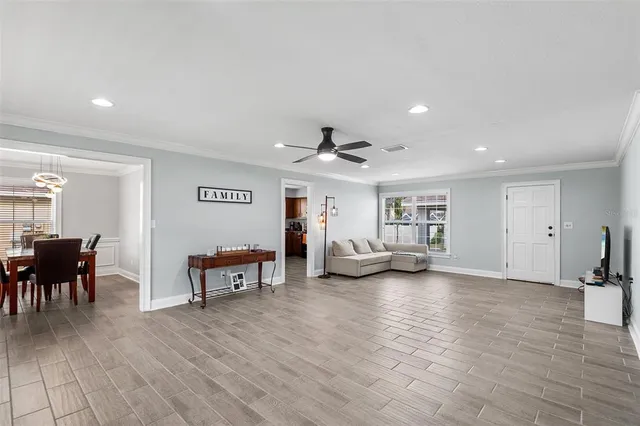 a view of a livingroom with furniture and a flat screen tv