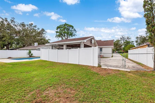 a backyard of a house with lots of green space