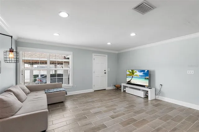 a living room with furniture and windows
