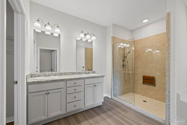 a view of hallway with wooden floor