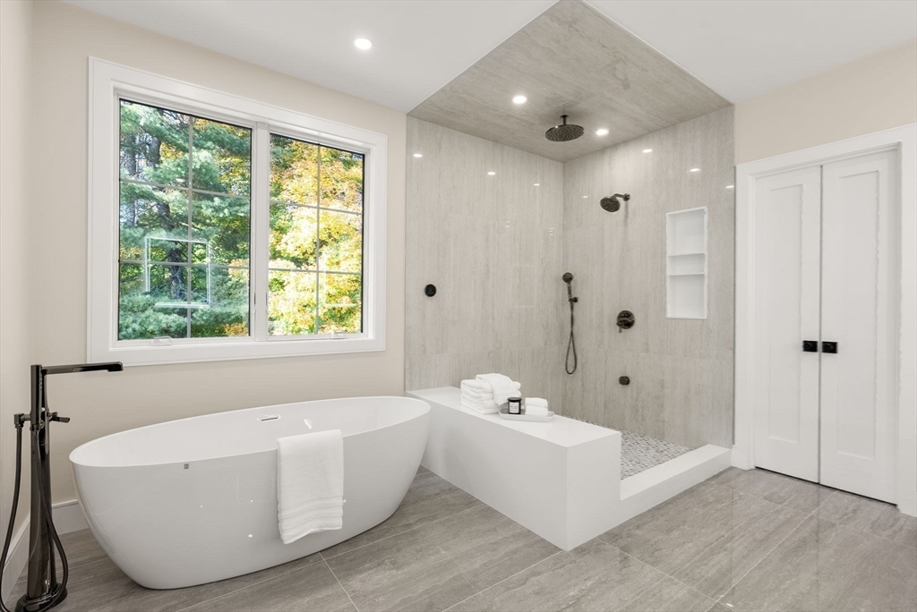 181 Wiswall Road Newton, MA 02459 - Photo 22 of 35 a bathroom with a bathtub and shower