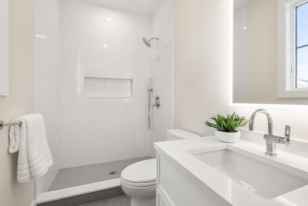 181 Wiswall Road Newton, MA 02459 - Photo 24 of 35 a bathroom with a sink toilet and shower