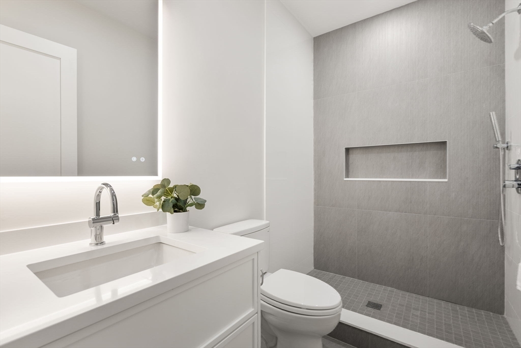 181 Wiswall Road Newton, MA 02459 - Photo 28 of 35 a bathroom with a sink and a toilet