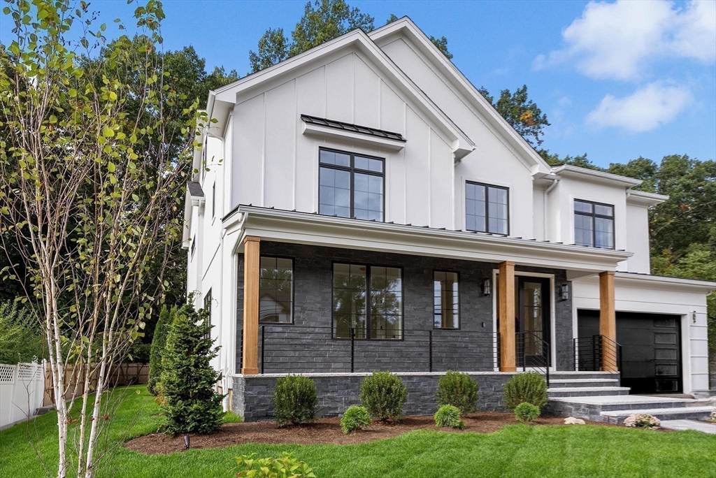 181 Wiswall Road Newton, MA 02459 - Photo 35 of 35 a view of a white house with potted plants and large windows