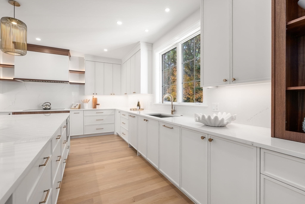 181 Wiswall Road Newton, MA 02459 - Photo 4 of 35 a kitchen with a sink window and cabinets