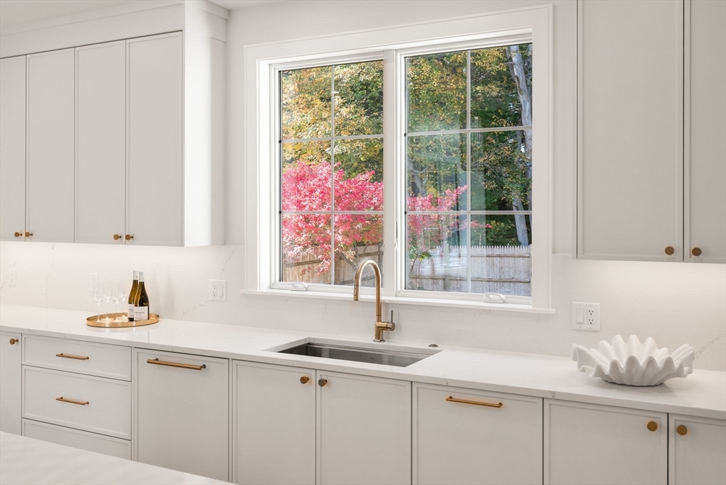 181 Wiswall Road Newton, MA 02459 - Photo 5 of 35 a kitchen with a sink and large window