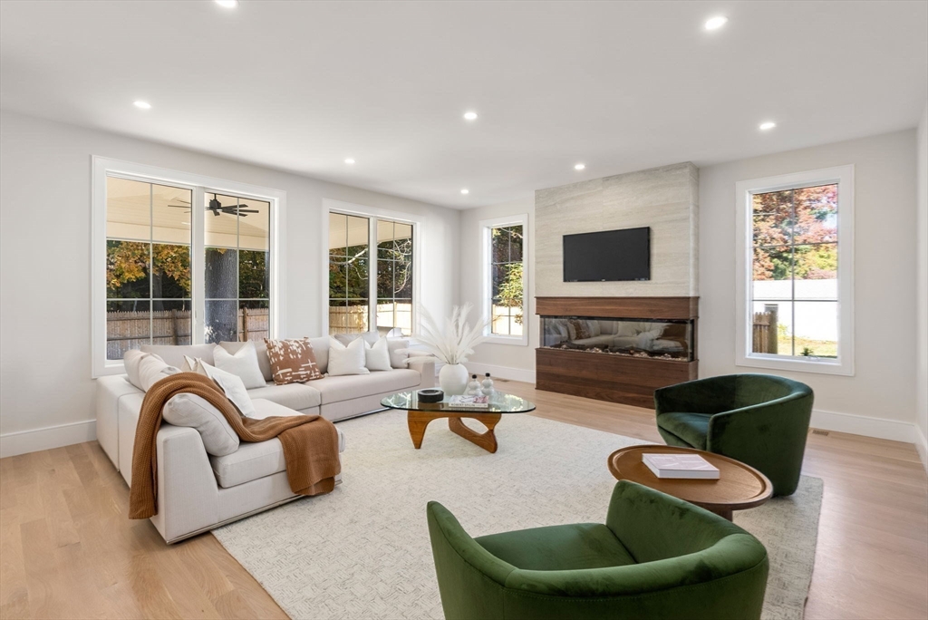 181 Wiswall Road Newton, MA 02459 - Photo 8 of 35 a living room with furniture and a fireplace