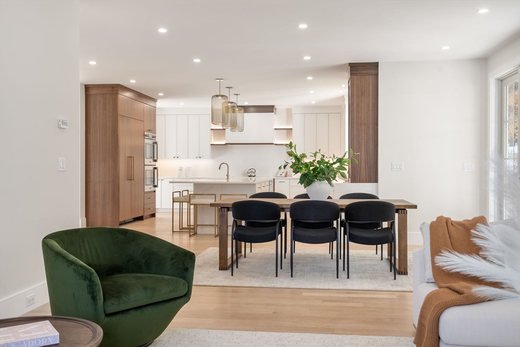 181 Wiswall Road Newton, MA 02459 - Photo 10 of 35 a living room with furniture potted plant and kitchen view