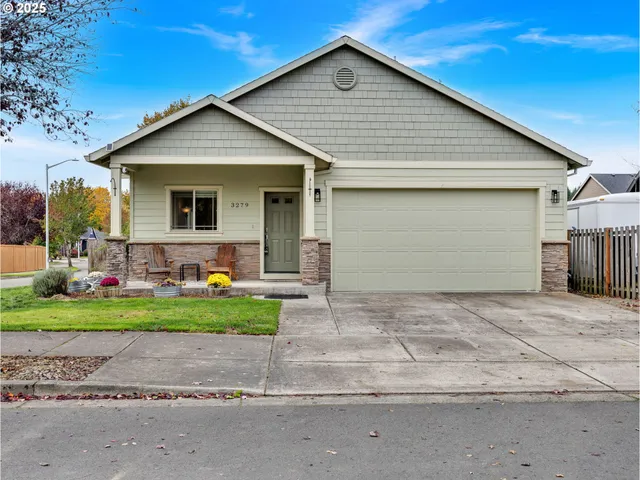 a front view of house with a yard and garage
