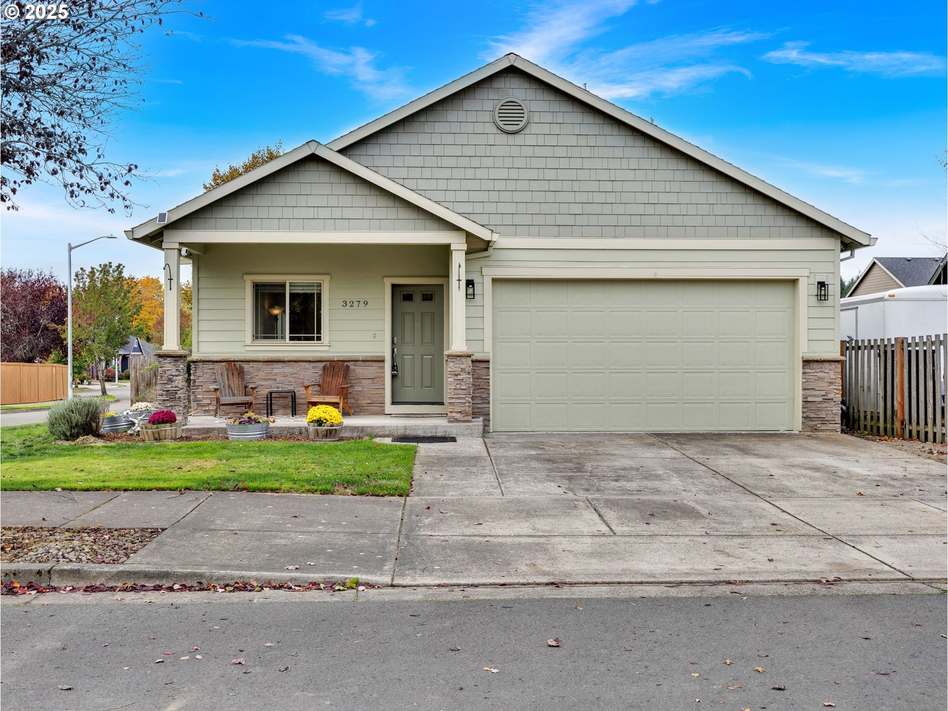 a front view of house with a yard and garage