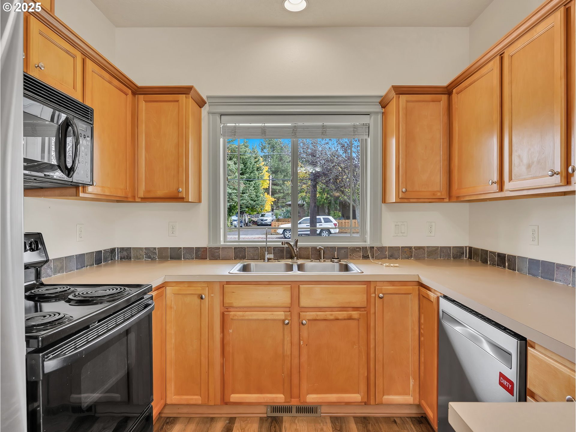 3279 Southeast Anderson Road Gresham, OR 97080 - Photo 11 of 42 a kitchen with a sink stove and cabinets