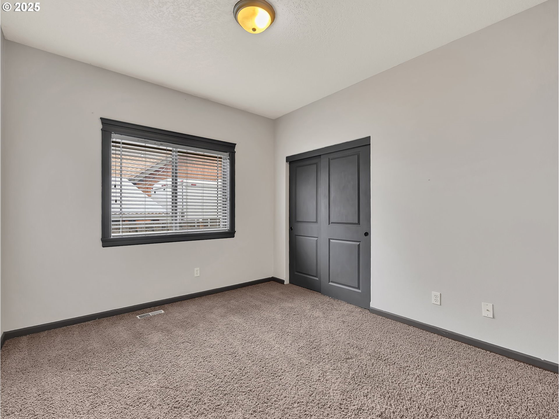 3279 Southeast Anderson Road Gresham, OR 97080 - Photo 25 of 42 a view of an empty room with closet and refrigerator