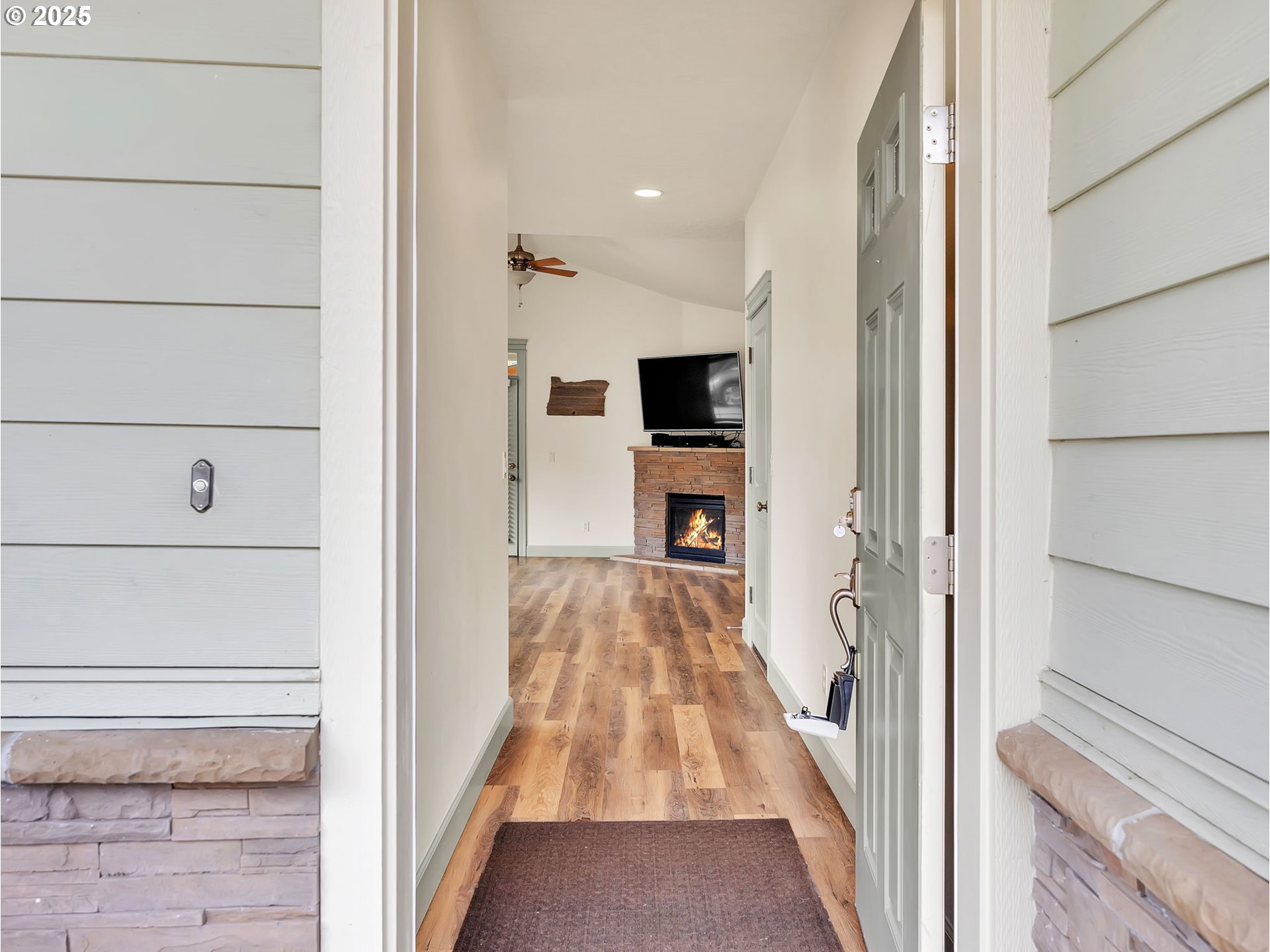 3279 Southeast Anderson Road Gresham, OR 97080 - Photo 3 of 42 a view of a hallway with wooden floor and staircase